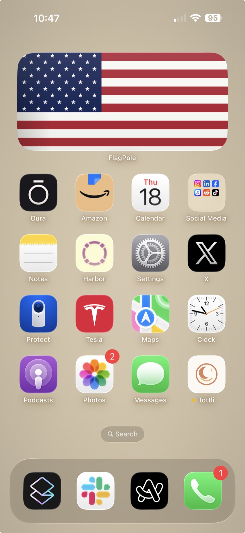 An iPhone home screen with the FlagPole widget at the top, showing an accurate American flag drawn to the right proportions.